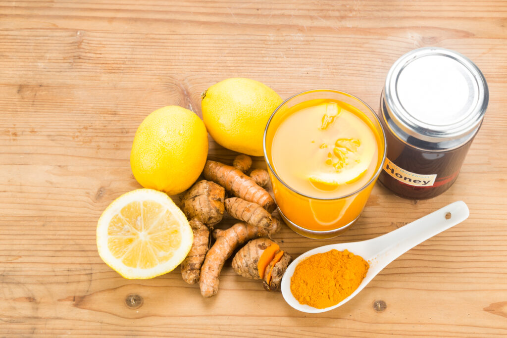 Turmeric roots with lemon and honey drinks, powerful healing bev