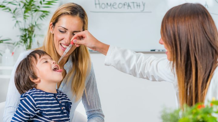 Homeopathy. Mother and little boy visiting a homeopath