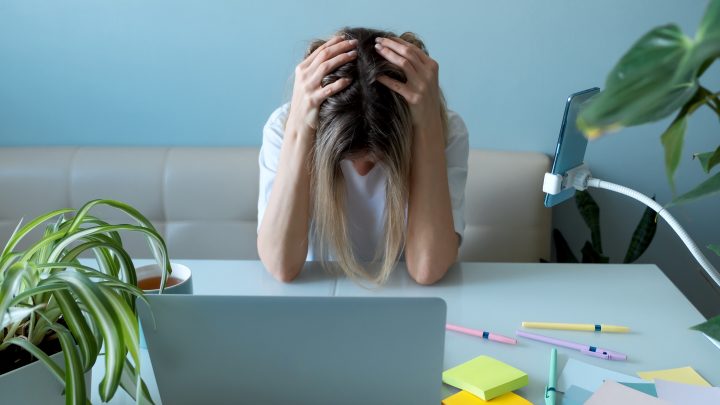 Woman freelancer in stress. No ideas. Emotional burnout at work